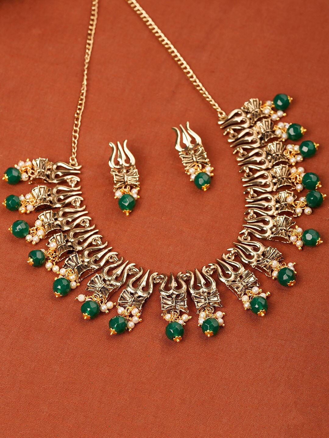Estele Gold Plated Antique Heavenly Thrishul & Damru Chocker Necklace Set for Women, Green
Estele Gold Plated Antique Heavenly Thrishul & Damru Chocker Necklace Set for Women, Green