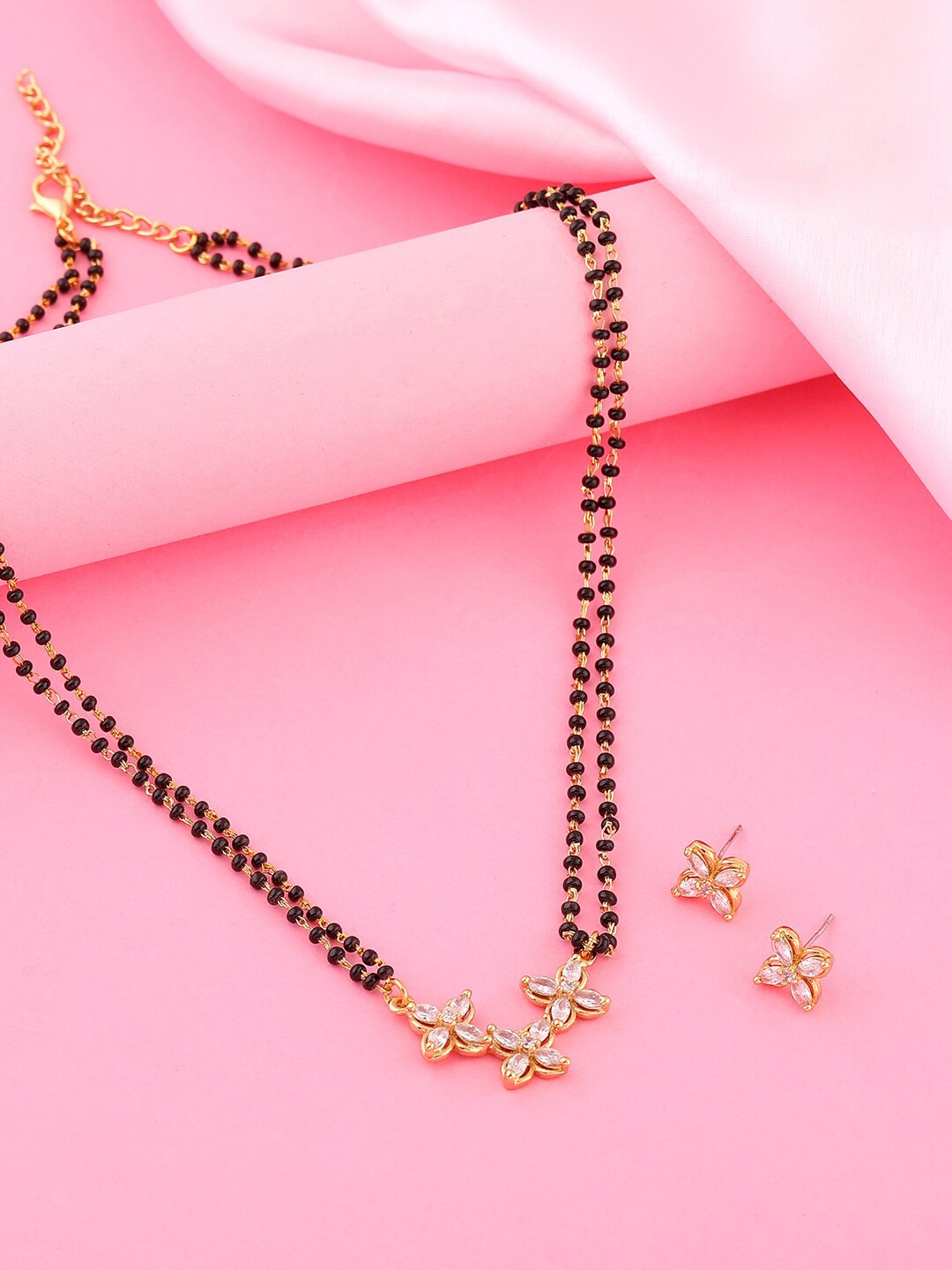 Estele Gold Plated CZ Glorious Trio floret Designer Mangalsutra & Earrings Set, White
Estele Gold Plated CZ Glorious Trio floret Designer Mangalsutra & Earrings Set, White