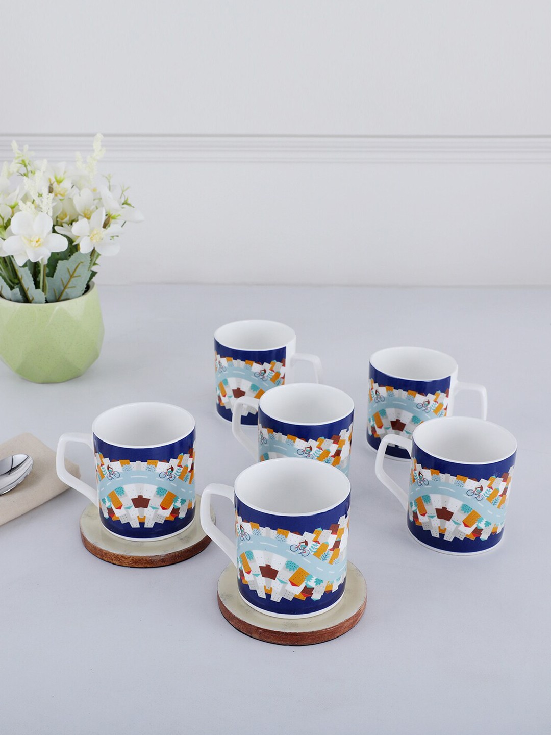 HomeTown Milan 6 Pcs Navy Blue & Orange Printed Bone China Glossy Tea Mugs 200 ml each
HomeTown Milan 6 Pcs Navy Blue & Orange Printed Bone China Glossy Tea Mugs 200 ml each