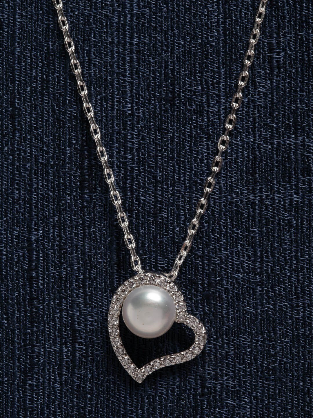 Clara 925 Sterling Silver Rhodium-Plated Pearl Studded Heart Shaped Pendant With Chain
Clara 925 Sterling Silver Rhodium-Plated Pearl Studded Heart Shaped Pendant With Chain