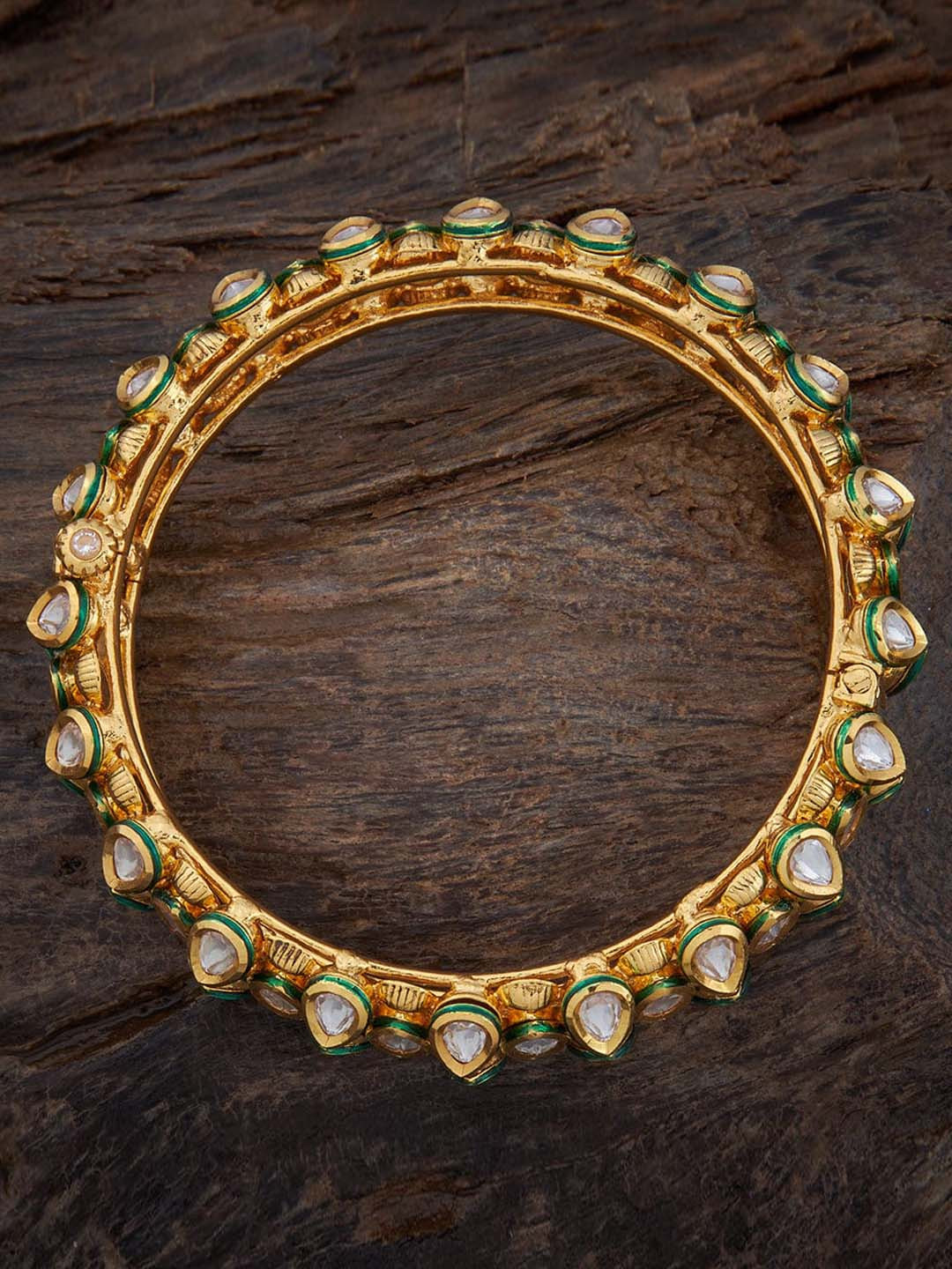 Kushal's Fashion Jewellery Gold-Plated Kundan-Studded Bangle
Kushal's Fashion Jewellery Gold-Plated Kundan-Studded Bangle