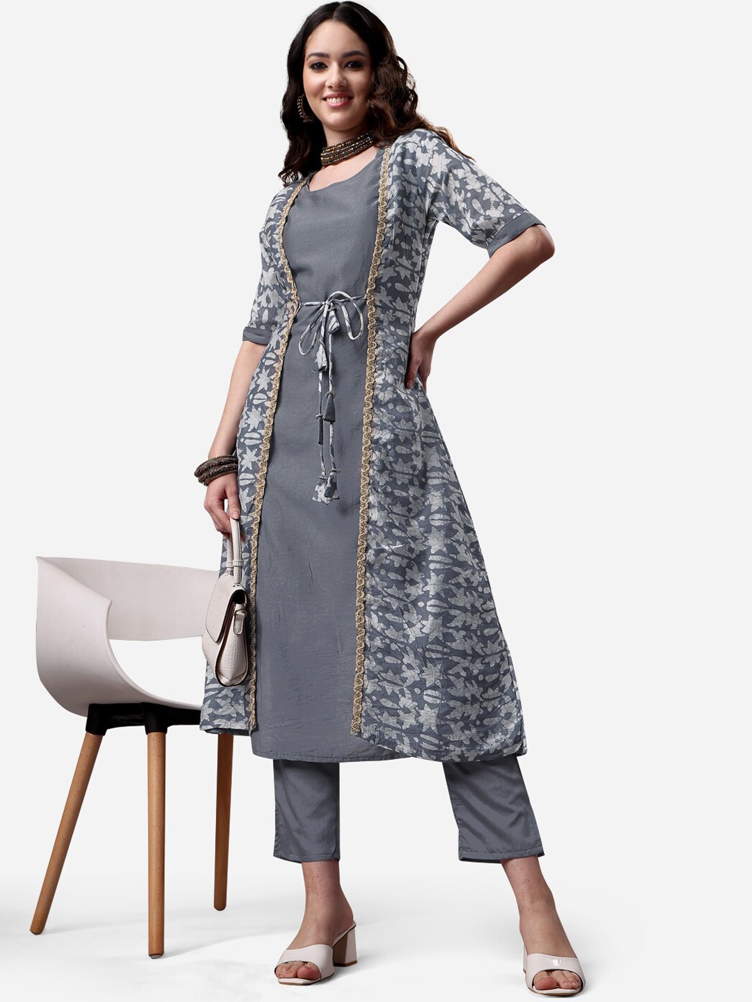 KALINI Women Solid Chanderi Kurta Trouser Set with Shibori Print Chanderi Jacket, Grey
KALINI Women Solid Chanderi Kurta Trouser Set with Shibori Print Chanderi Jacket, Grey