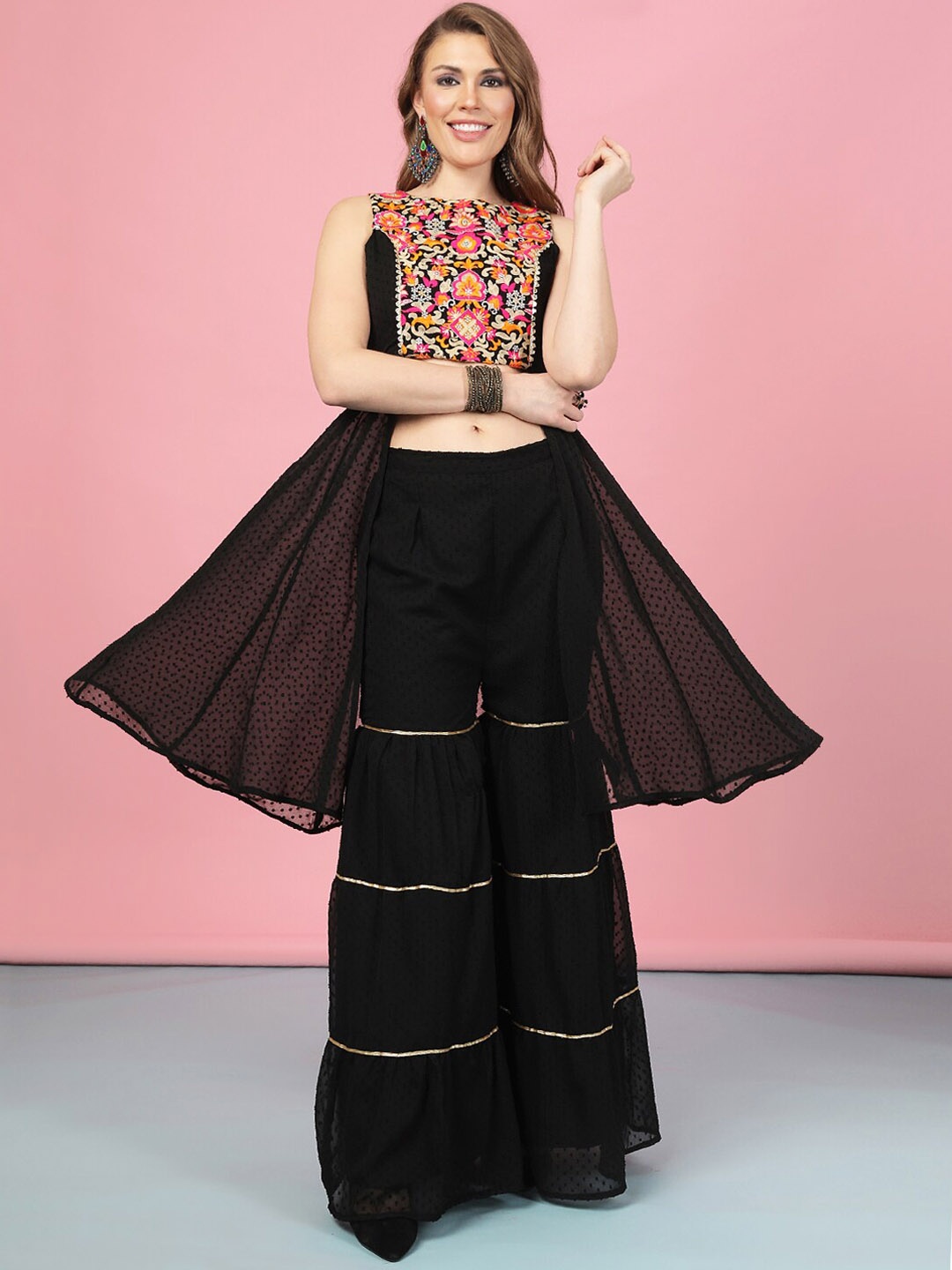 A.T.U.N. Front Slit A-Line Dobby Ethnic Motifs Embroidered Kurta with Sharara, Black
A.T.U.N. Front Slit A-Line Dobby Ethnic Motifs Embroidered Kurta with Sharara, Black