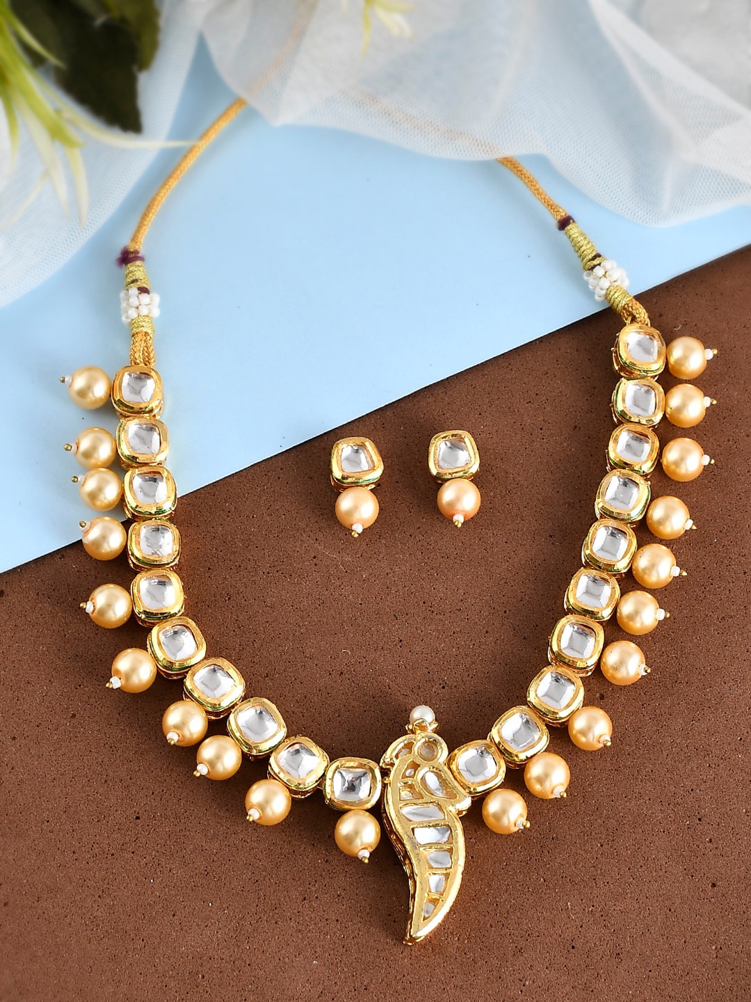 Sanjog Gold-Plated Kundan-Studded Peacock Pendant Meenakari Choker Jewellery Set, White
Sanjog Gold-Plated Kundan-Studded Peacock Pendant Meenakari Choker Jewellery Set, White