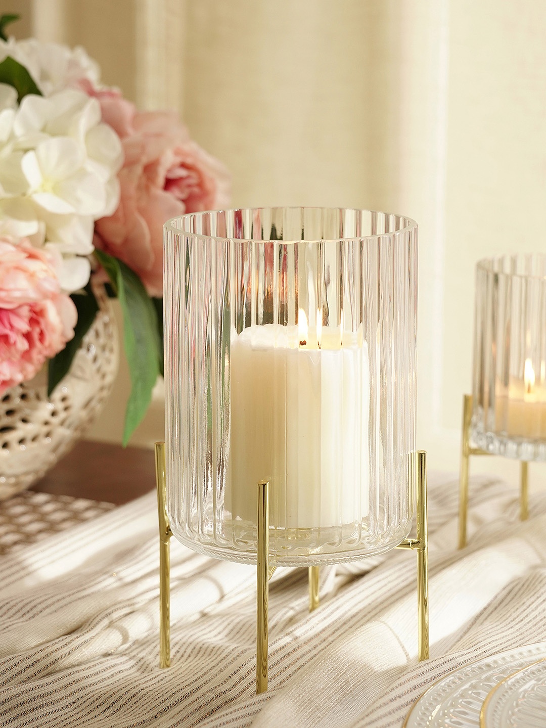 Pure Home and Living Transparent & Gold Toned Ribbed Glass Hurricane With Metal Stand Candle Holder
Pure Home and Living Transparent & Gold Toned Ribbed Glass Hurricane With Metal Stand Candle Holder
