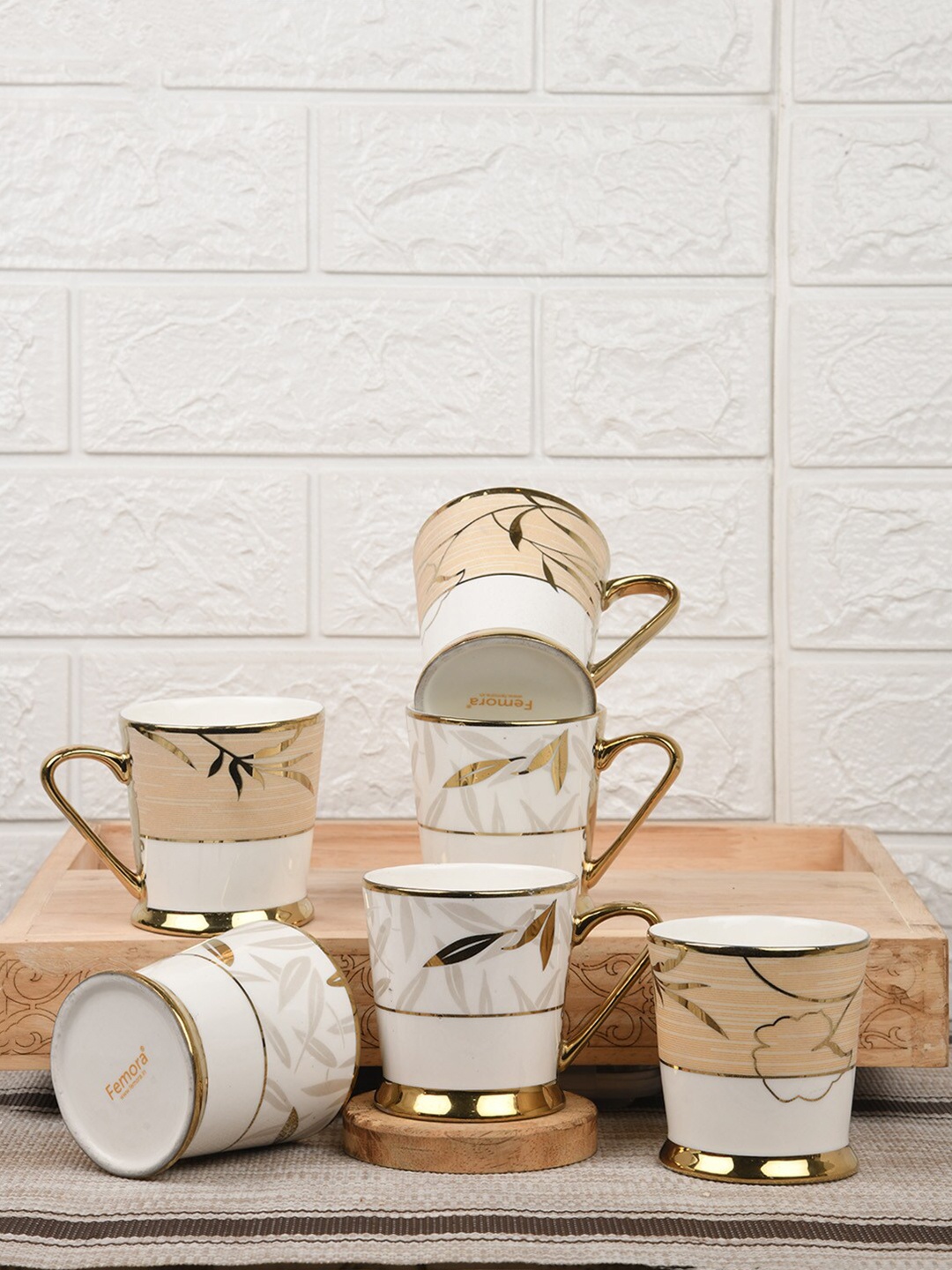 Femora Fine White & Gold-Toned 6 Pieces Floral Leaves Printed Bone China Cups 200 ml Each
Femora Fine White & Gold-Toned 6 Pieces Floral Leaves Printed Bone China Cups 200 ml Each
