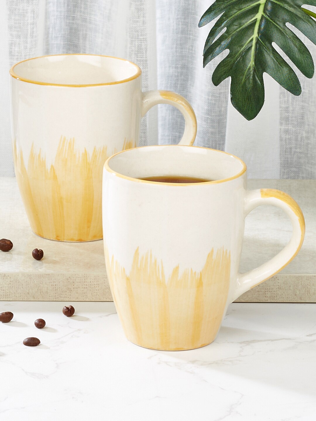 HomeTown Ophilia Studio Yellow & White 2 Pieces Printed Stoneware Glossy Mugs 320 ml Each
HomeTown Ophilia Studio Yellow & White 2 Pieces Printed Stoneware Glossy Mugs 320 ml Each