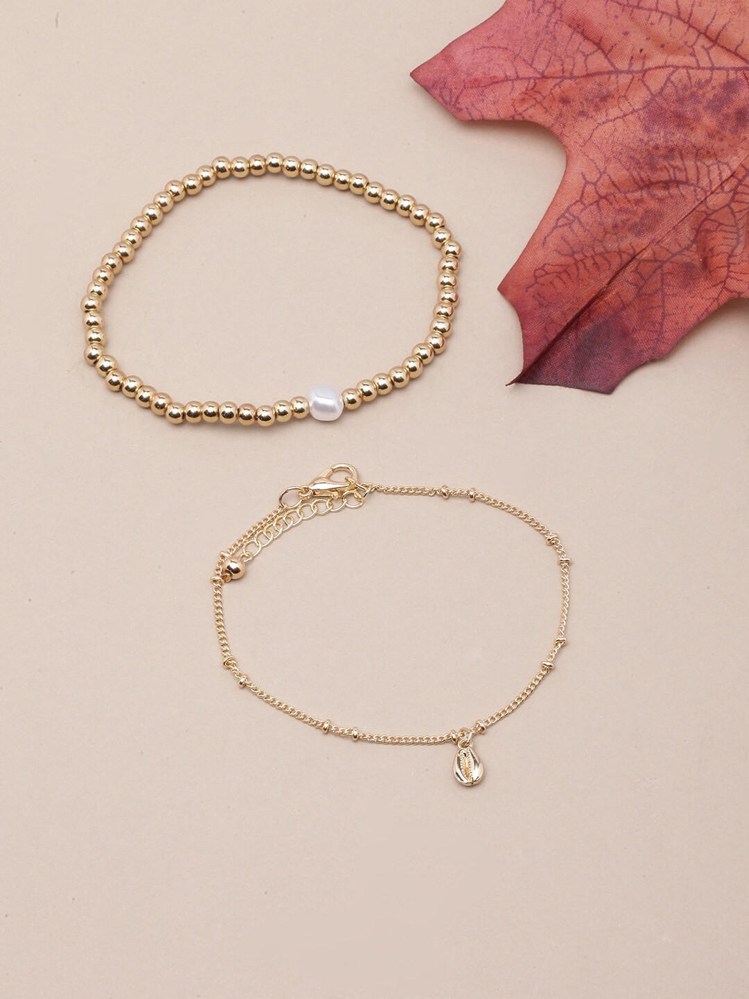 DIVA WALK Women 2 Gold-Toned & White Brass Pearls Antique Gold-Plated Charm Bracelet
DIVA WALK Women 2 Gold-Toned & White Brass Pearls Antique Gold-Plated Charm Bracelet