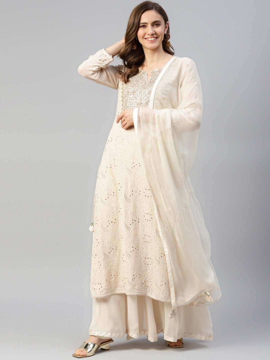 Divena Ethnic Motiifs Embroidered Zardozi Gotta Patti Kurta with Sharara & Dupatta, Off white
Divena Ethnic Motiifs Embroidered Zardozi Gotta Patti Kurta with Sharara & Dupatta, Off white