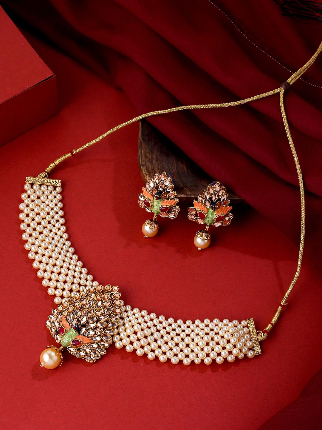 Yellow Chimes Gold-Plated Kundan-Studded & Pearl-Beaded Peacock designed Choker Jewellery Set, White
Yellow Chimes Gold-Plated Kundan-Studded & Pearl-Beaded Peacock designed Choker Jewellery Set, White