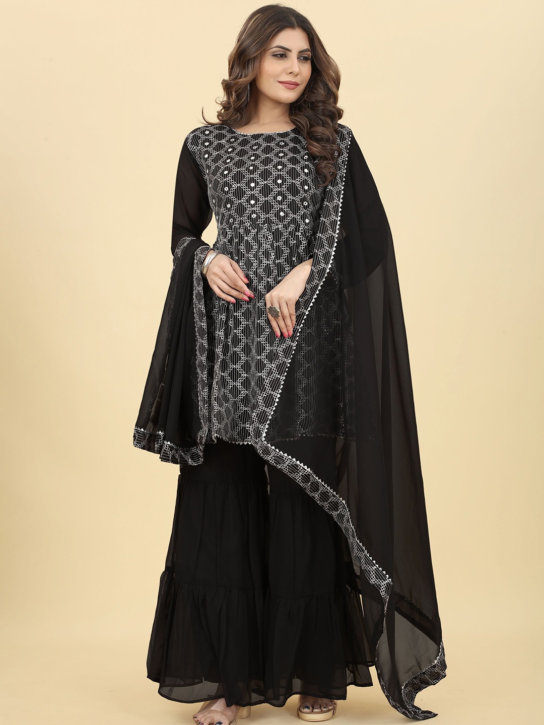 KALINI Embroidered Mirror Work Anrakali Georgette Kurta with Sharara & Dupatta, Black
KALINI Embroidered Mirror Work Anrakali Georgette Kurta with Sharara & Dupatta, Black