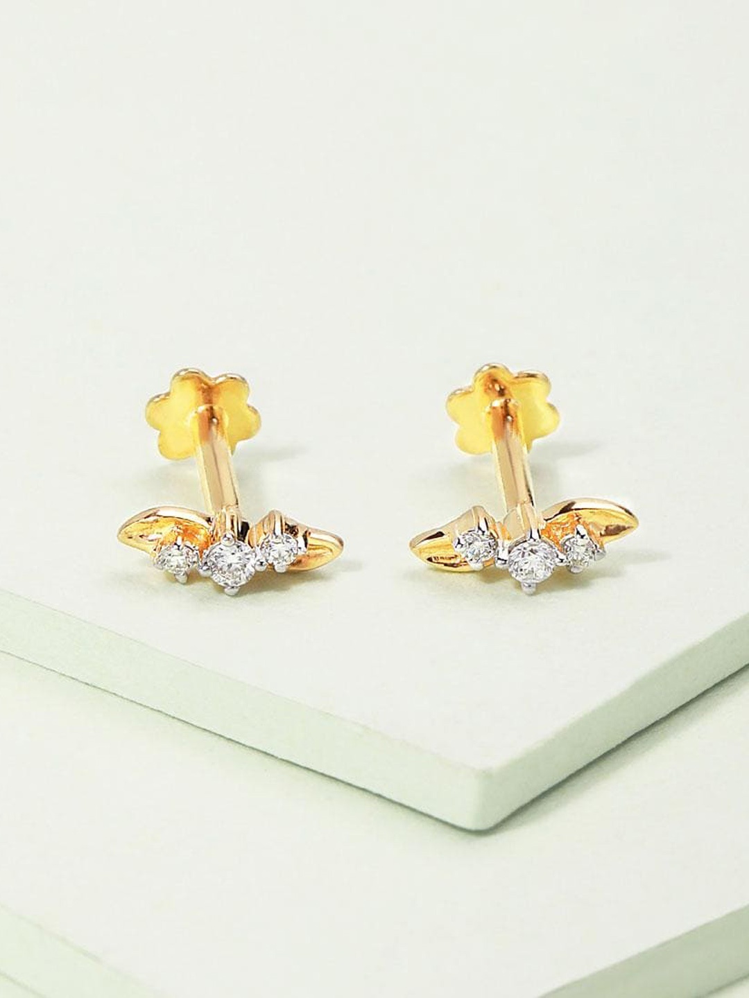 CANDERE A KALYAN JEWELLERS COMPANY Diamond-Studded18KT Gold Stud Earrings - 0.95 gm, Yellow
CANDERE A KALYAN JEWELLERS COMPANY Diamond-Studded18KT Gold Stud Earrings - 0.95 gm, Yellow