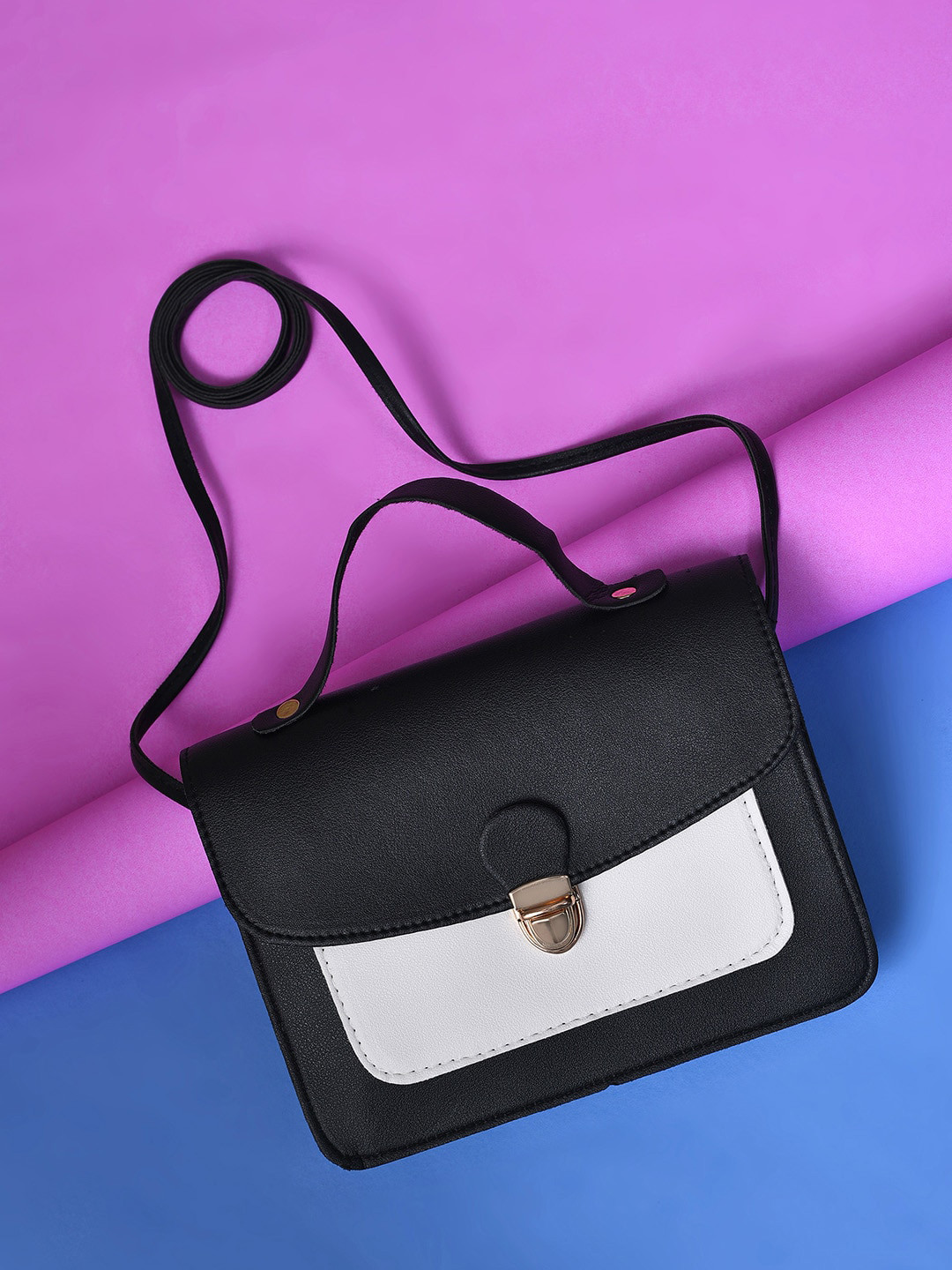 HAUTE SAUCE by Campus Sutra Colourblocked PU Water Resistant Structured Sling Bag, Black
HAUTE SAUCE by Campus Sutra Colourblocked PU Water Resistant Structured Sling Bag, Black