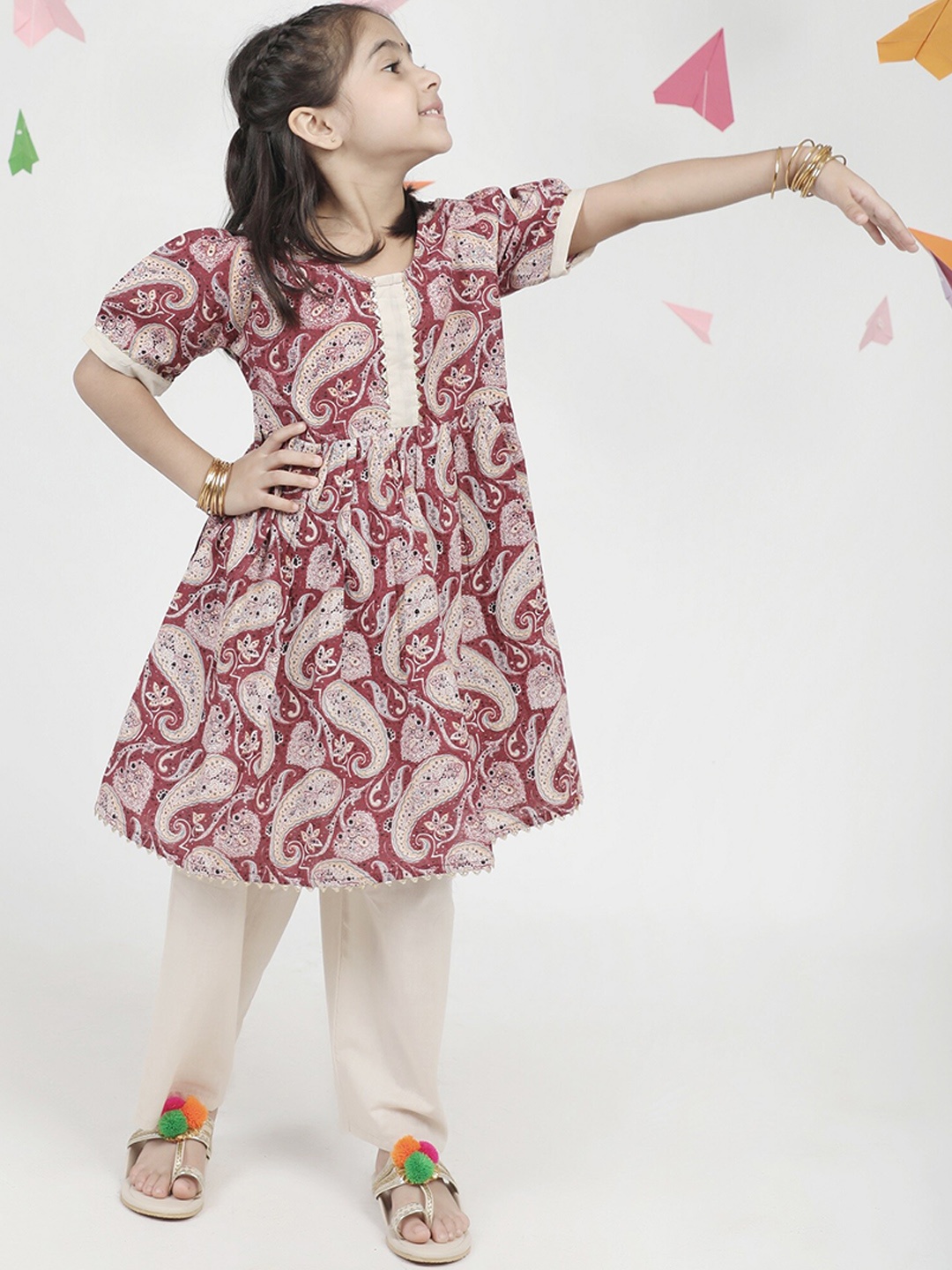 Aj DEZInES Girls Printed Puff Sleeves Pure Cotton Anarkali Kurta With Trousers, Maroon
Aj DEZInES Girls Printed Puff Sleeves Pure Cotton Anarkali Kurta With Trousers, Maroon