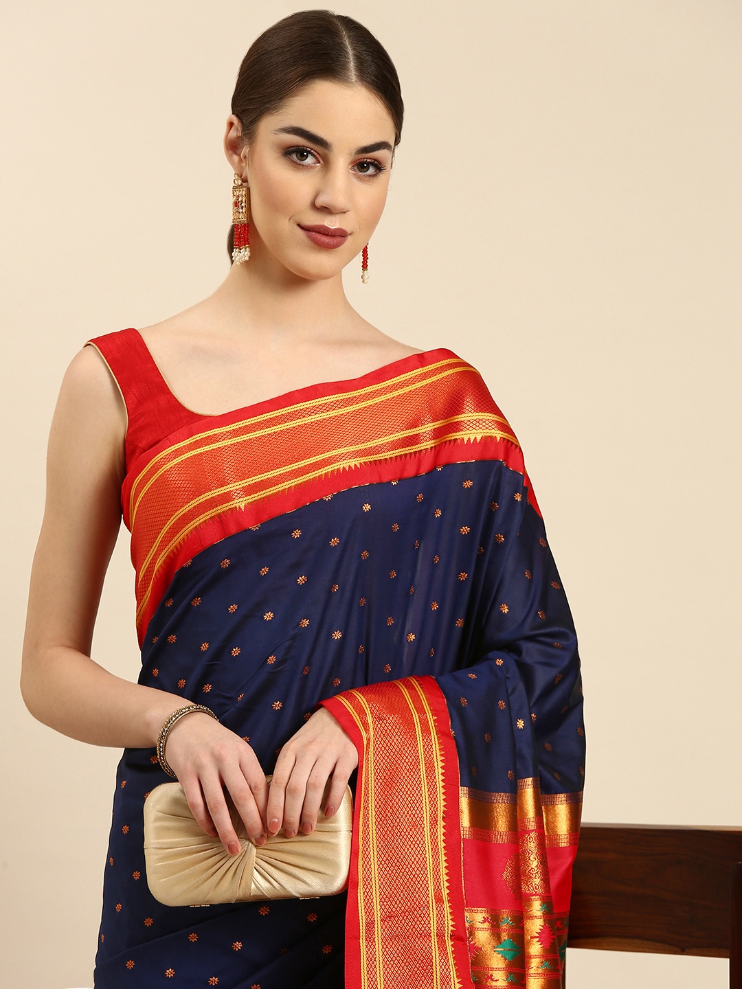 Varkala Silk Sarees Navy Blue & Red Ethnic Motifs Zari Silk Blend Paithani Saree
Varkala Silk Sarees Navy Blue & Red Ethnic Motifs Zari Silk Blend Paithani Saree