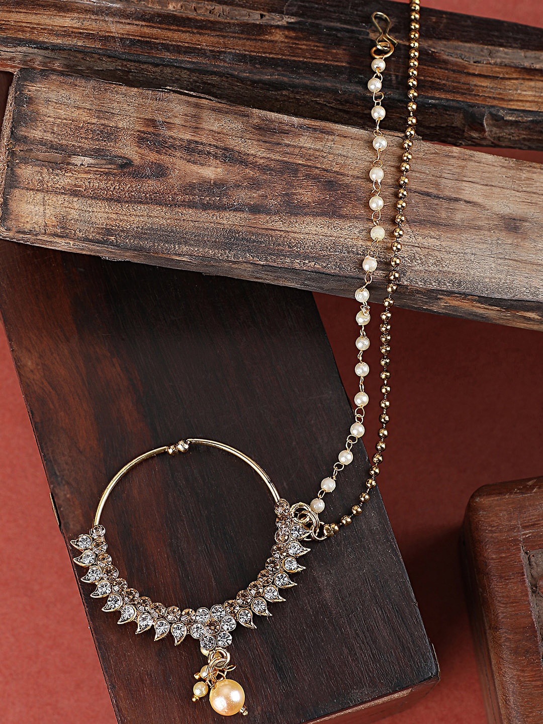 ANIKAS CREATION Gold-Plated Kundan-Studded Clip-On Nosepin With Beaded Extension, White
ANIKAS CREATION Gold-Plated Kundan-Studded Clip-On Nosepin With Beaded Extension, White