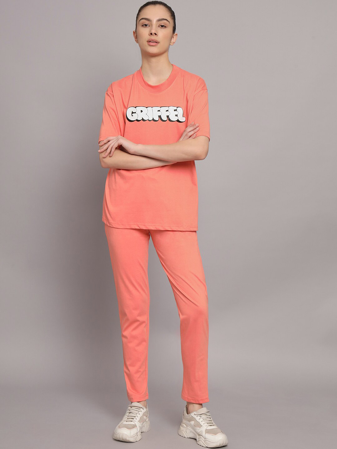 GRIFFEL Women Printed T-shirt with Track Pants, Peach 
GRIFFEL Women Printed T-shirt with Track Pants, Peach