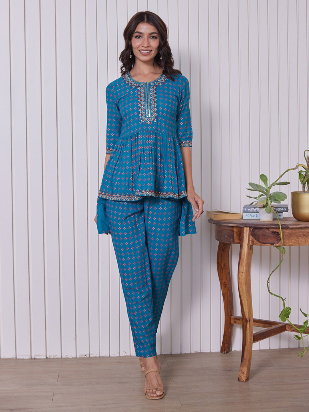 HERE&NOW Ethnic Motifs Embroidered Thread Work & Sequinned High-Low Kurti with Trousers, Turquoise blue 
HERE&NOW Ethnic Motifs Embroidered Thread Work & Sequinned High-Low Kurti with Trousers, Turquoise blue