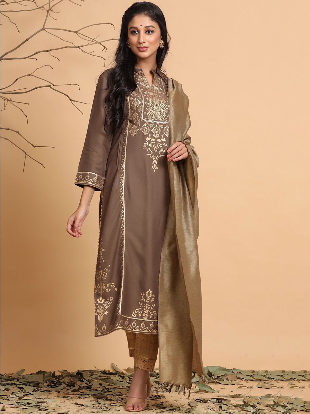 Juniper Band Collar Ethnic Motifs Printed Foil Kurta with Trousers & Dupatta, Brown
Juniper Band Collar Ethnic Motifs Printed Foil Kurta with Trousers & Dupatta, Brown