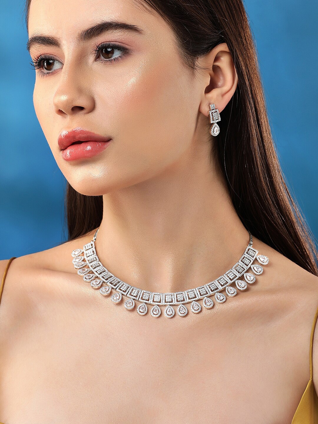 Rubans Rhodium-plated Premium white Pear & Round Zircons studded Statement Jewellery set, Silver
Rubans Rhodium-plated Premium white Pear & Round Zircons studded Statement Jewellery set, Silver