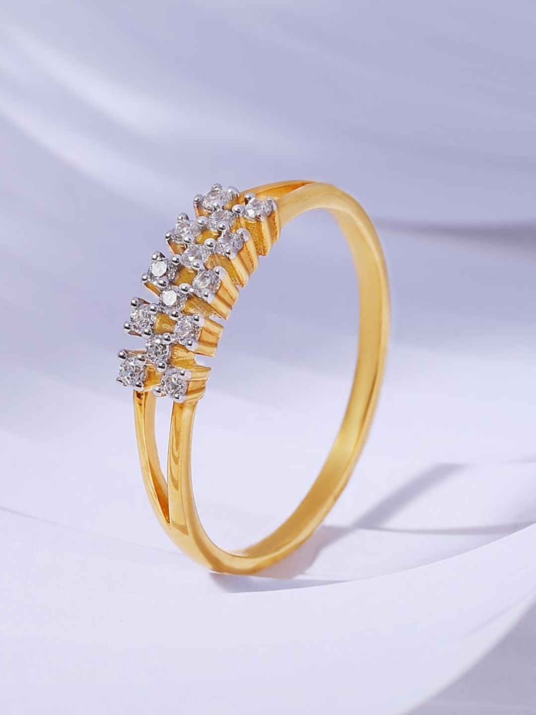CANDERE A KALYAN JEWELLERS COMPANY Cubic Zirconia Studded 18KT Gold Finger Ring-2.33gm
CANDERE A KALYAN JEWELLERS COMPANY Cubic Zirconia Studded 18KT Gold Finger Ring-2.33gm