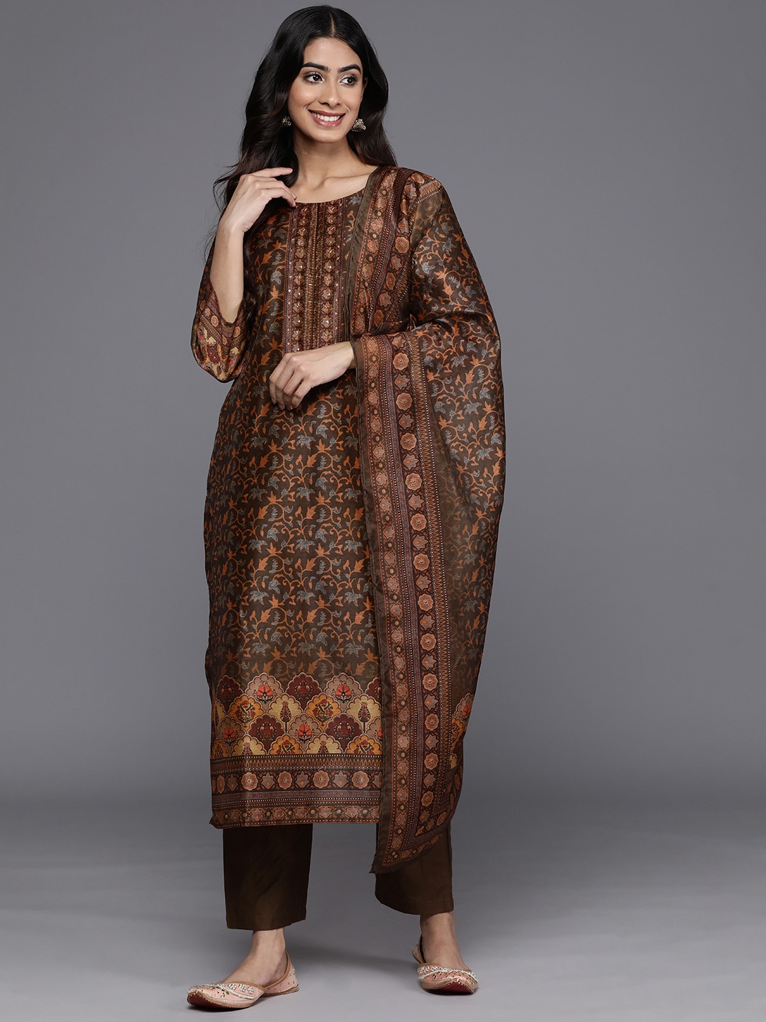 Varanga Floral Printed Regular Sequinned Chanderi Silk Kurta with Trousers & With Dupatta, Brown
Varanga Floral Printed Regular Sequinned Chanderi Silk Kurta with Trousers & With Dupatta, Brown