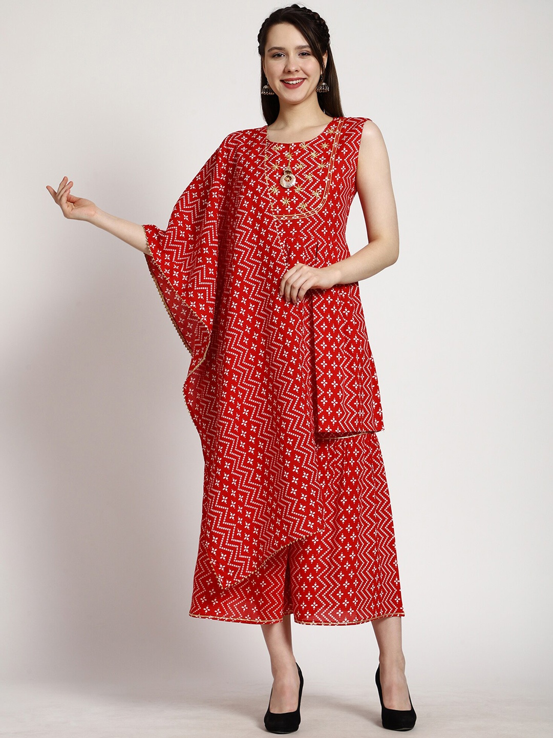 SkyaSia Bandhani Printed Sleeveless Thread Work Empire Kurti With Sharara & Dupatta, Red
SkyaSia Bandhani Printed Sleeveless Thread Work Empire Kurti With Sharara & Dupatta, Red