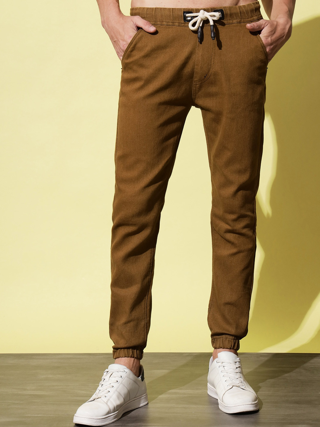 UNITED DENIM Men Mid Rise Jogger Stretchable Denim Trousers, Brown
UNITED DENIM Men Mid Rise Jogger Stretchable Denim Trousers, Brown