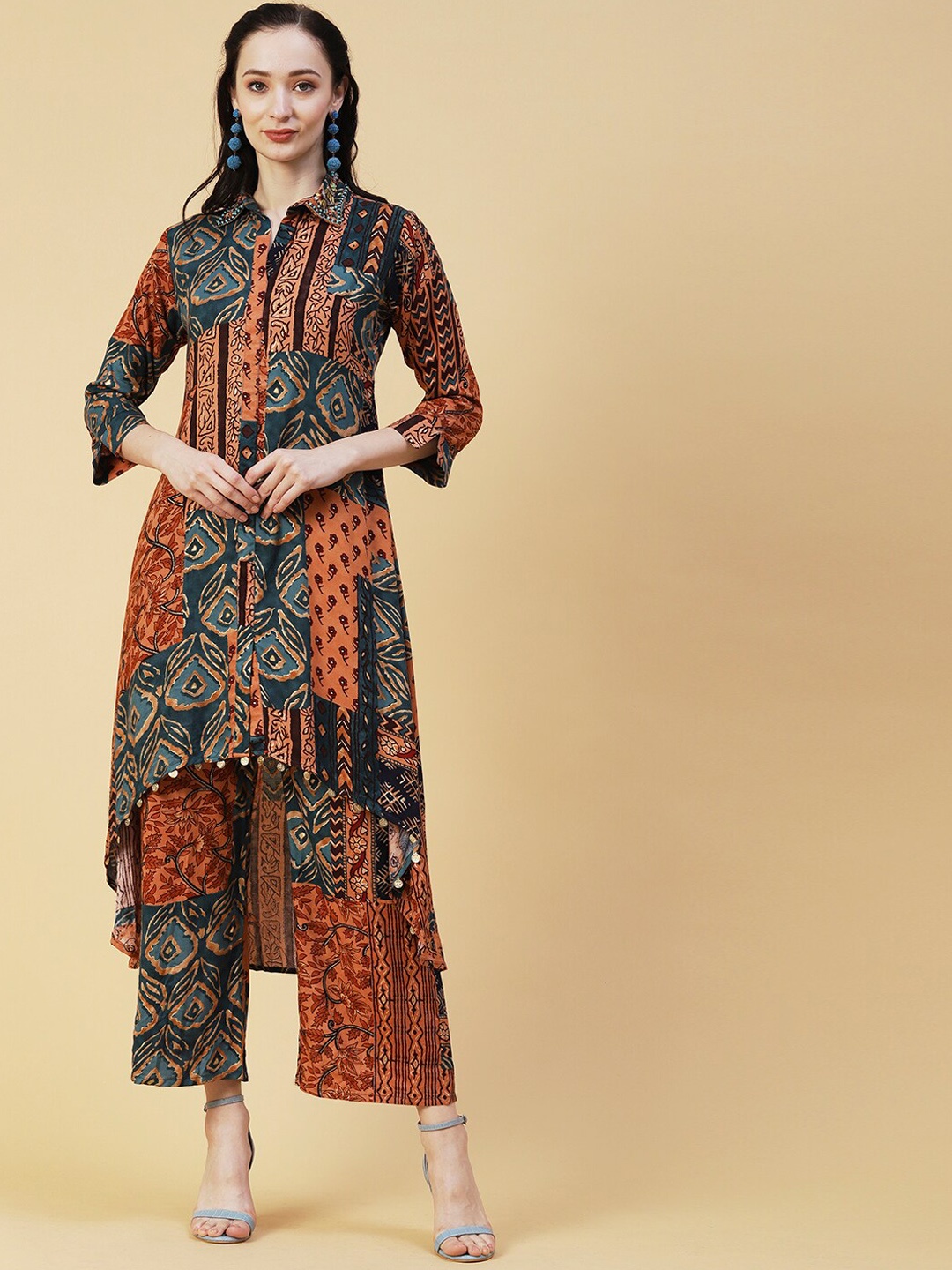 Envy Me by FASHOR Ethnic Motifs Printed Beads and Stones Asymmetric Kurta with Palazzos, Peach
Envy Me by FASHOR Ethnic Motifs Printed Beads and Stones Asymmetric Kurta with Palazzos, Peach