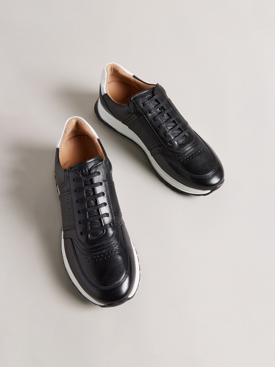 Ted Baker Men Saffiano Perforations Comfort Insole Leather Contrast Sole Sneakers, Black
Ted Baker Men Saffiano Perforations Comfort Insole Leather Contrast Sole Sneakers, Black