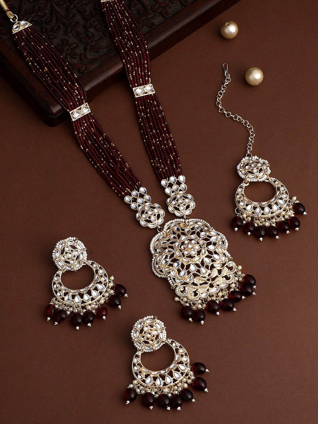 ASMITTA JEWELLERY Gold-Plated Stone-Studded Beaded Necklace and Earrings with Maang Tika
ASMITTA JEWELLERY Gold-Plated Stone-Studded Beaded Necklace and Earrings with Maang Tika