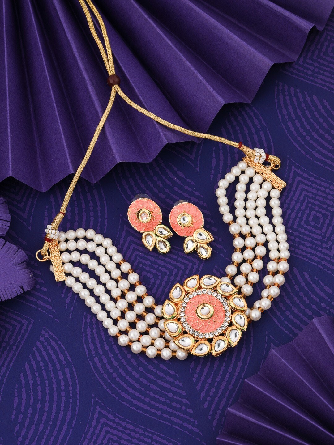 Vita Bella Gold-Plated Kundan-Studded & Beaded Necklace and Earrings Jewellery Set
Vita Bella Gold-Plated Kundan-Studded & Beaded Necklace and Earrings Jewellery Set