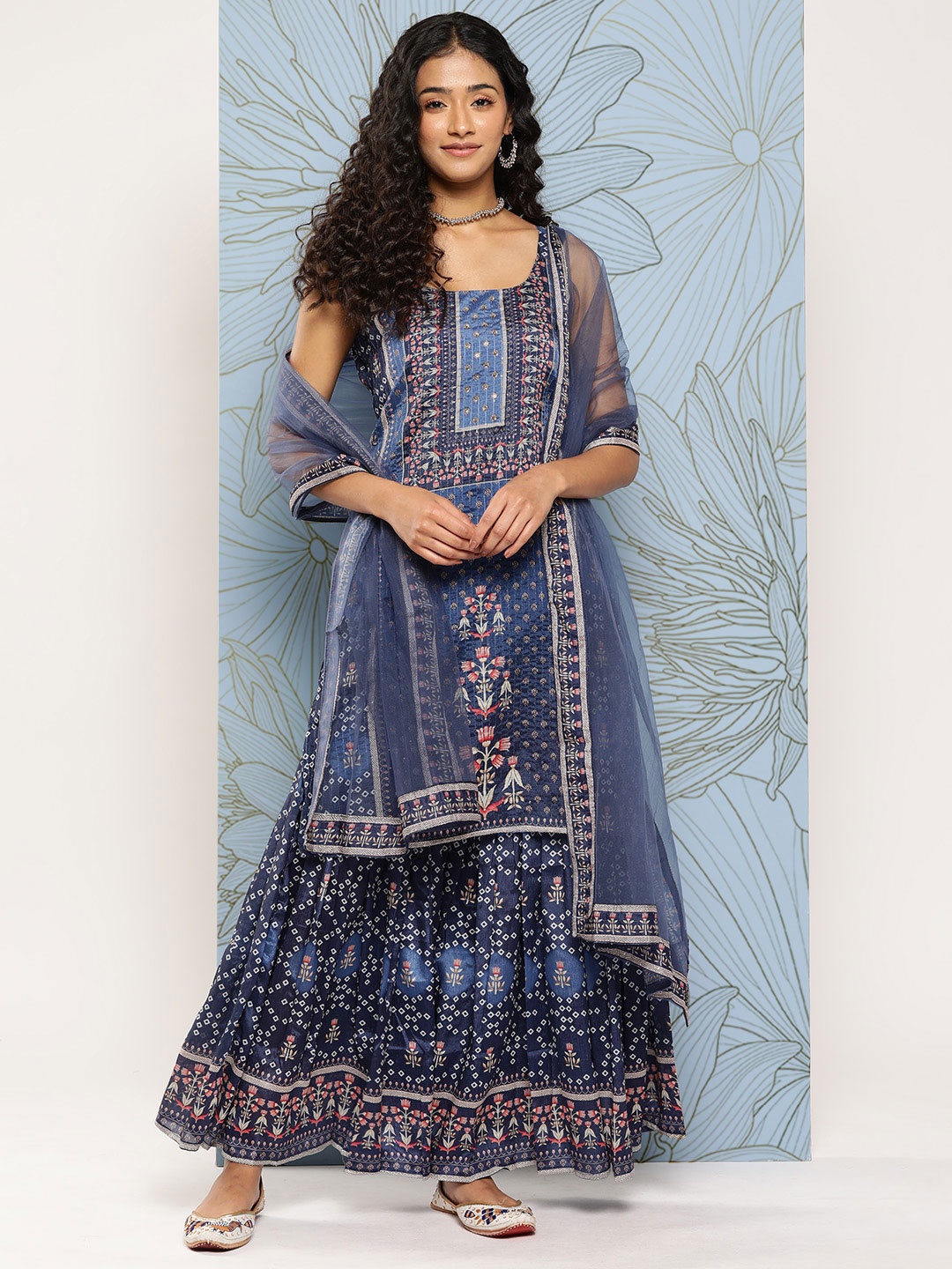Varanga Floral Printed Regular Beads and Stones Kurta with Sharara & With Dupatta, Blue
Varanga Floral Printed Regular Beads and Stones Kurta with Sharara & With Dupatta, Blue