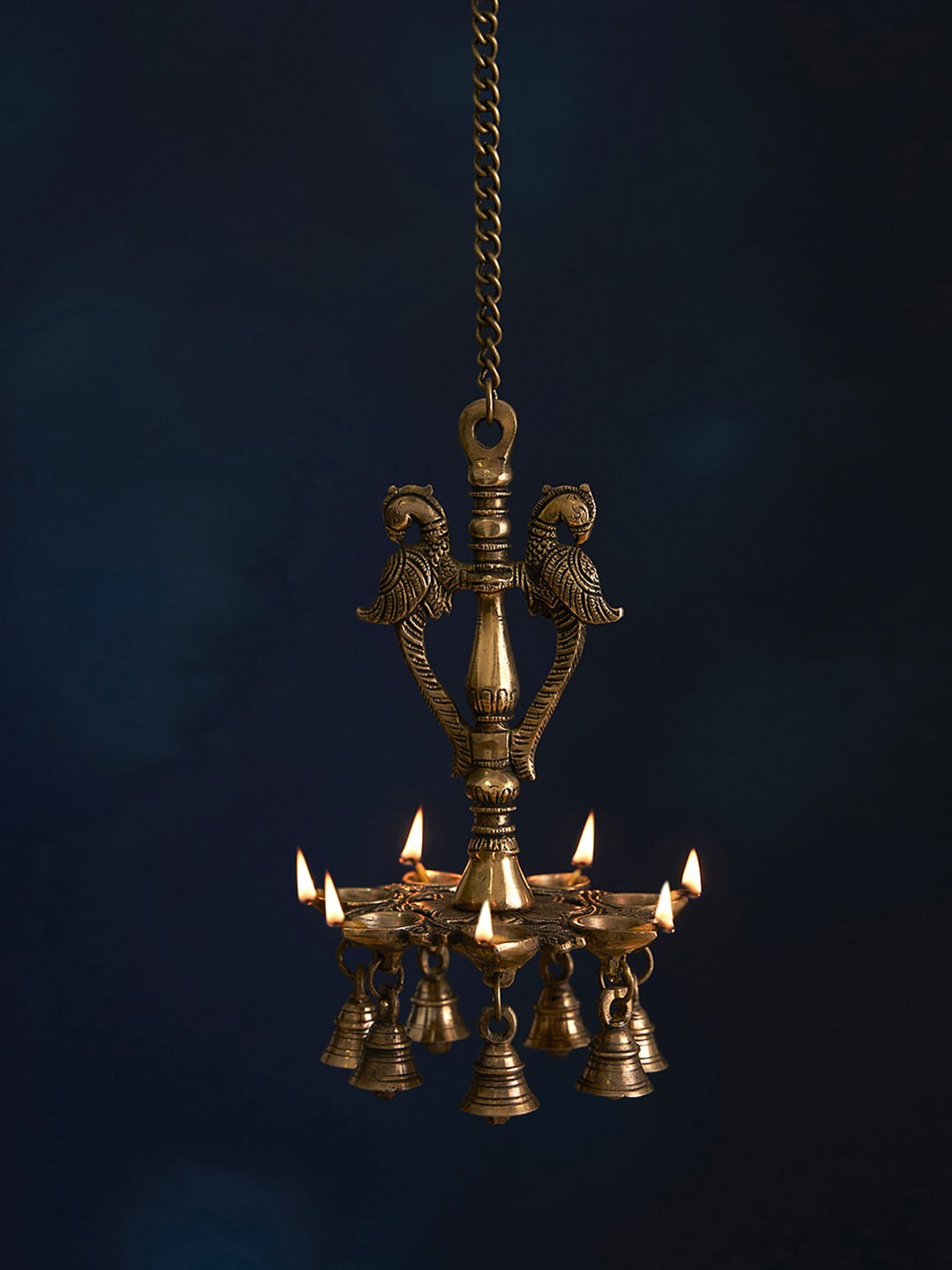 DecorTwist Brass Antique Peacock Shaped Hanging Diyas with Bells for Pooja Room, Gold
DecorTwist Brass Antique Peacock Shaped Hanging Diyas with Bells for Pooja Room, Gold