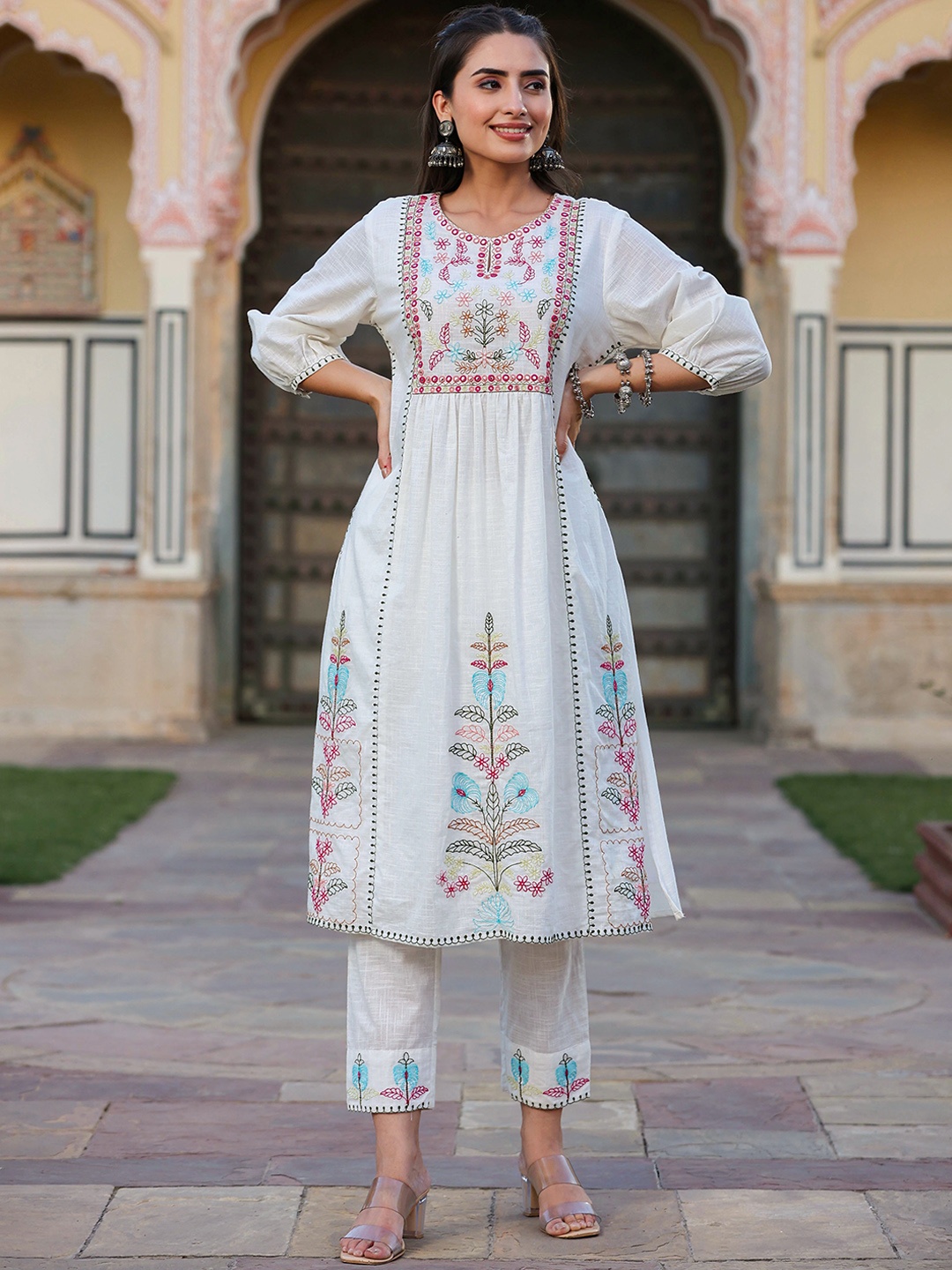 Juniper White & Pink Ethnic Motif Yoke Design Mirror Work A-Line Kurta With Trousers
Juniper White & Pink Ethnic Motif Yoke Design Mirror Work A-Line Kurta With Trousers