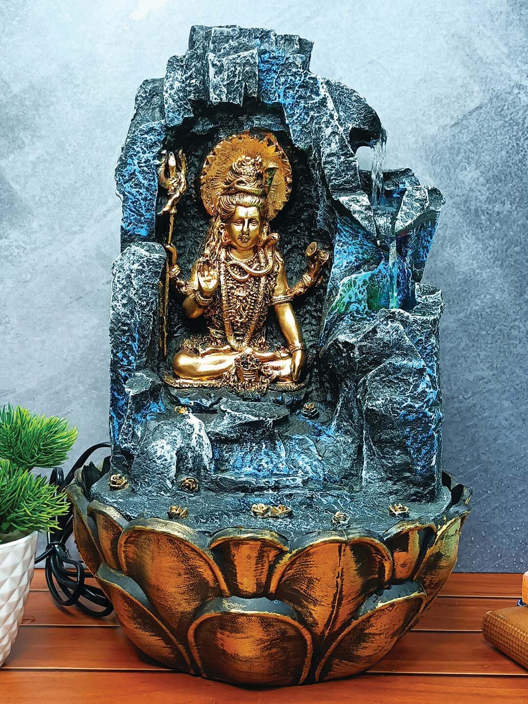 WENS Grey & Gold-Toned Lord Shiva Indoor Polyresin Water Fall Fountain With Led Lights, Blue
WENS Grey & Gold-Toned Lord Shiva Indoor Polyresin Water Fall Fountain With Led Lights, Blue