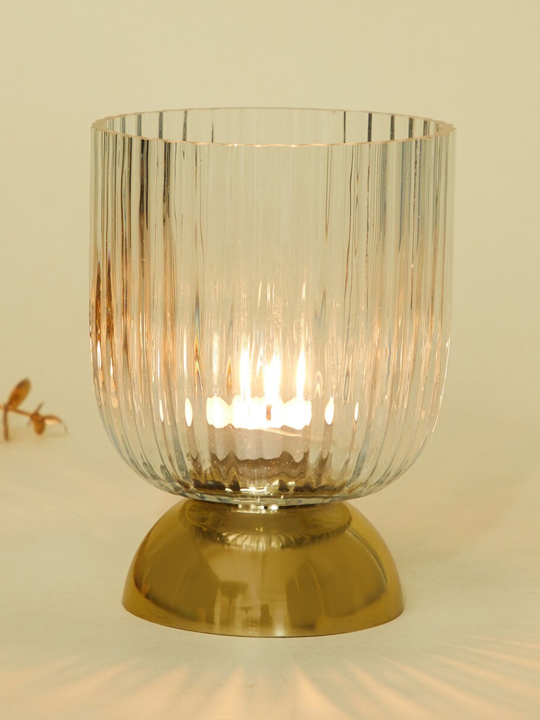 Home Centre Splendid Dastkari Transparent Glass T-Light Candle Holder With Metal Stand
Home Centre Splendid Dastkari Transparent Glass T-Light Candle Holder With Metal Stand