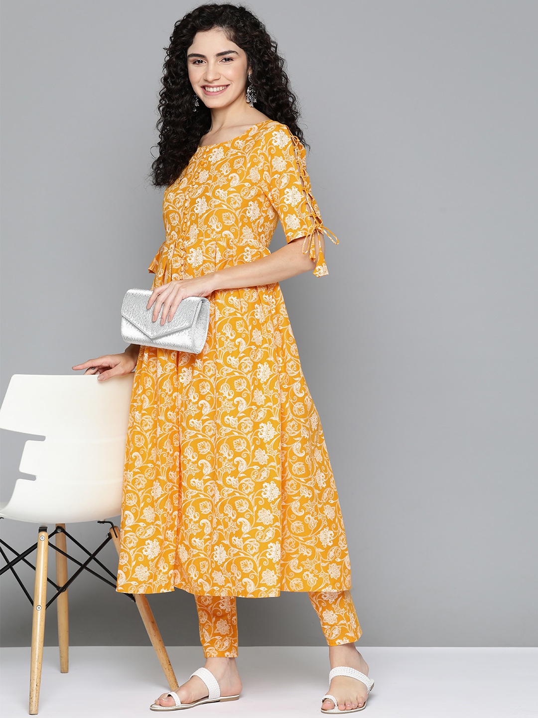 HERE&NOW Floral Printed High Slit Lace-Up Detail Pure Cotton Kurta with Trousers, Mustard
HERE&NOW Floral Printed High Slit Lace-Up Detail Pure Cotton Kurta with Trousers, Mustard
