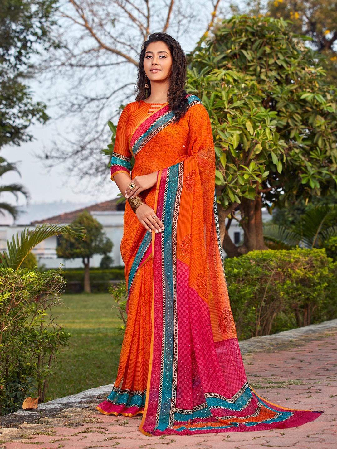 DIVASTRI Ethnic Motifs Printed Embellished Saree, Orange