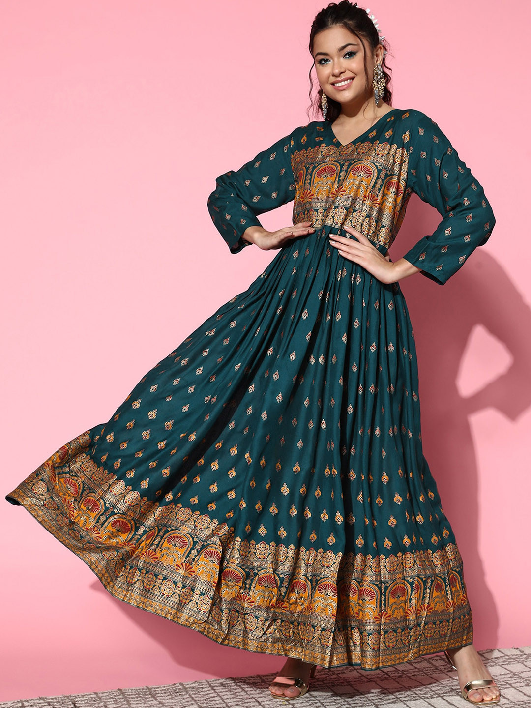 InWeave Teal & Gold-Toned V-Neck Ethnic Motifs Printed Fit & Flare Maxi Ethnic Dress
InWeave Teal & Gold-Toned V-Neck Ethnic Motifs Printed Fit & Flare Maxi Ethnic Dress
