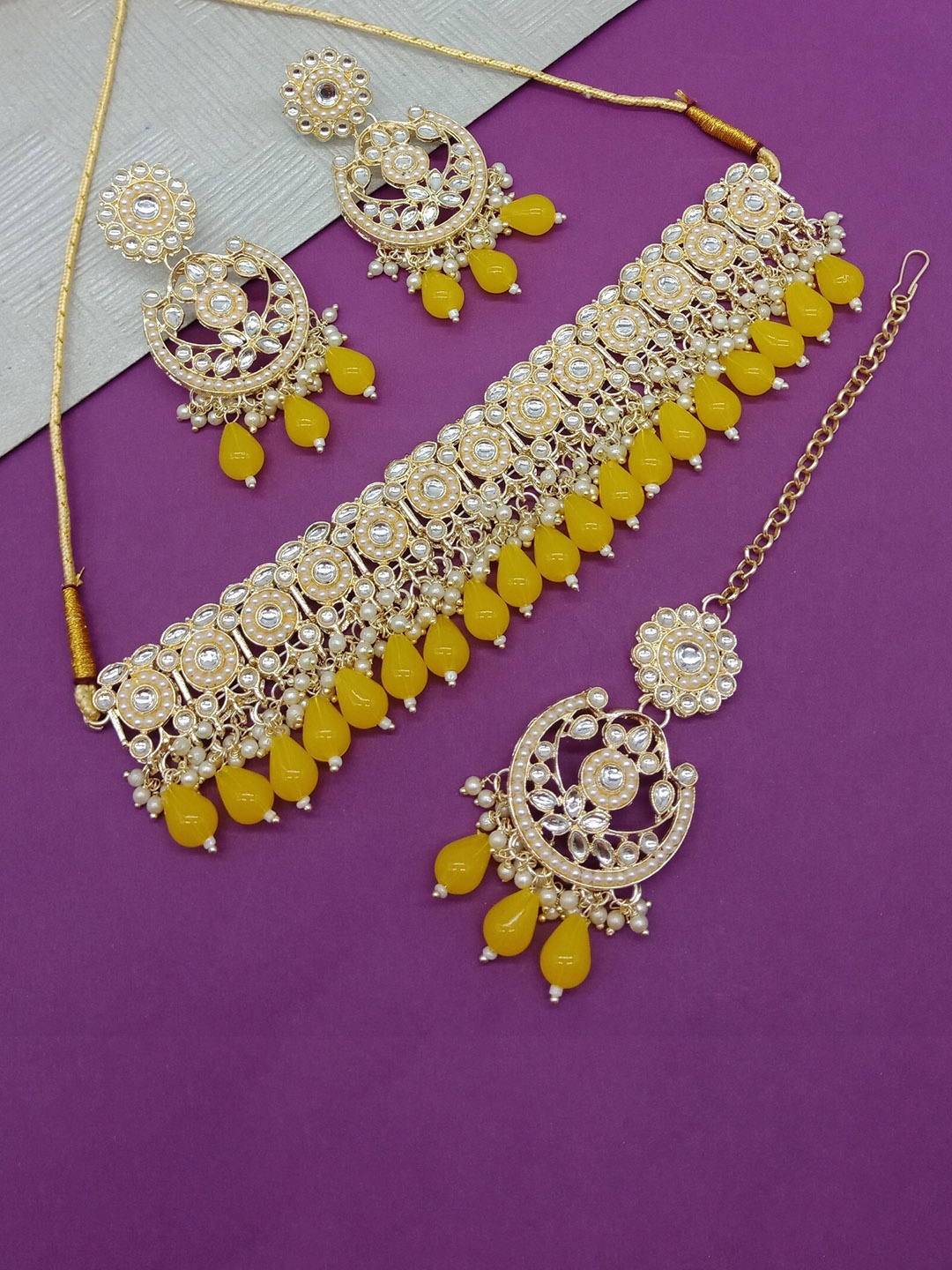 AASHISH IMITATION Gold Plated Kundan Studded & Beaded Necklace & Earrings With Maang Tika
AASHISH IMITATION Gold Plated Kundan Studded & Beaded Necklace & Earrings With Maang Tika