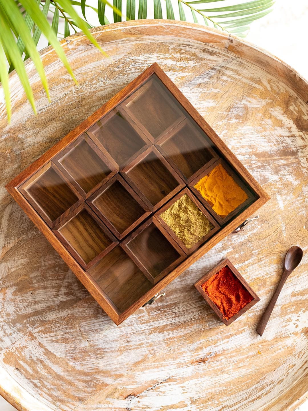 ExclusiveLane Brown Medley of Masalas Sheesham Wood Handcrafted Spice Box With Spoon
ExclusiveLane Brown Medley of Masalas Sheesham Wood Handcrafted Spice Box With Spoon