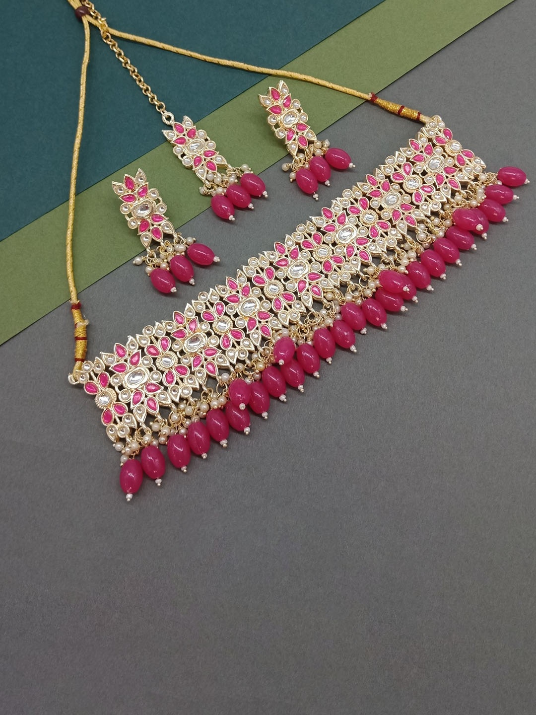 AASHISH IMITATION Gold-Plated Kundan-Studded & Beaded Necklace & Earrings With Maang Tika
AASHISH IMITATION Gold-Plated Kundan-Studded & Beaded Necklace & Earrings With Maang Tika