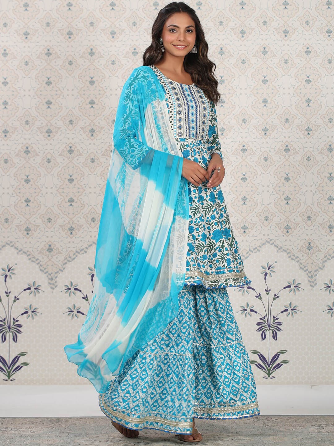 Ode by House of Pataudi Blue Floral Printed Empire Kurta With Sharara &Dupatta, Off white
Ode by House of Pataudi Blue Floral Printed Empire Kurta With Sharara &Dupatta, Off white