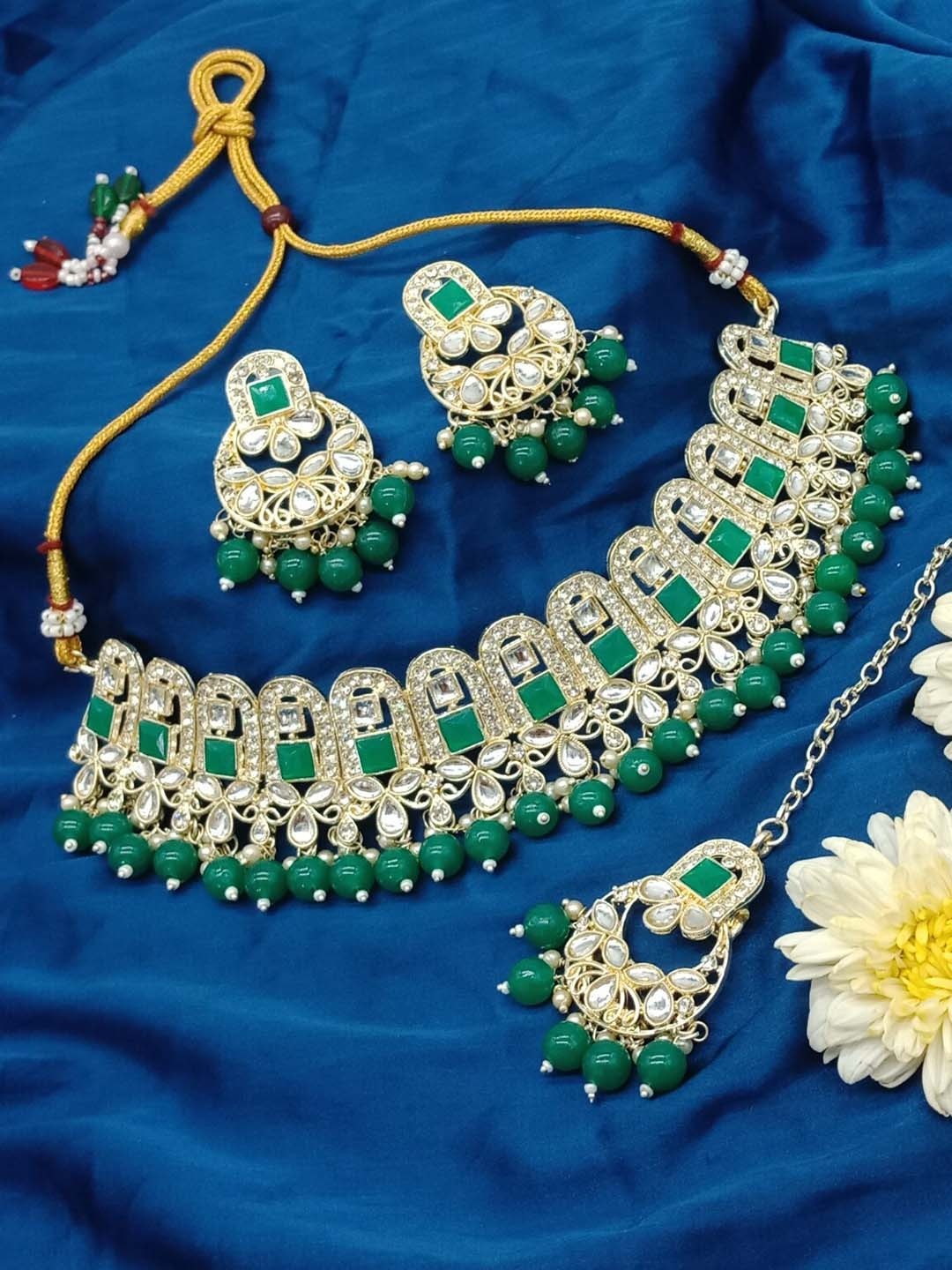 AASHISH IMITATION Gold-Plated Kundan-Studded & Beaded Necklace & Earrings With Maangtika
AASHISH IMITATION Gold-Plated Kundan-Studded & Beaded Necklace & Earrings With Maangtika
