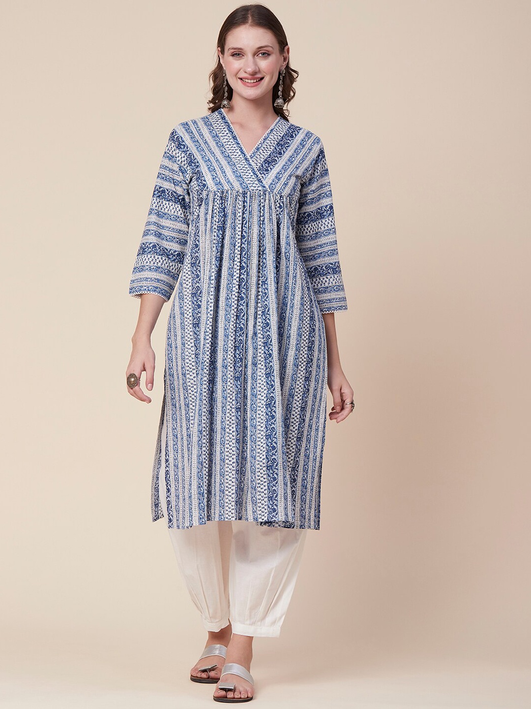 FASHOR Blue & White Colour Ethnic Motifs Printed Empire Kurta With Trousers
FASHOR Blue & White Colour Ethnic Motifs Printed Empire Kurta With Trousers
