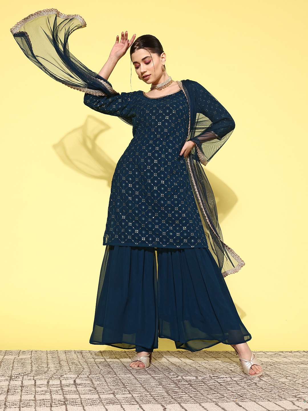 Indo Era Women Embroidered Regular Sequinned Kurta with Sharara & With Dupatta, Teal
Indo Era Women Embroidered Regular Sequinned Kurta with Sharara & With Dupatta, Teal