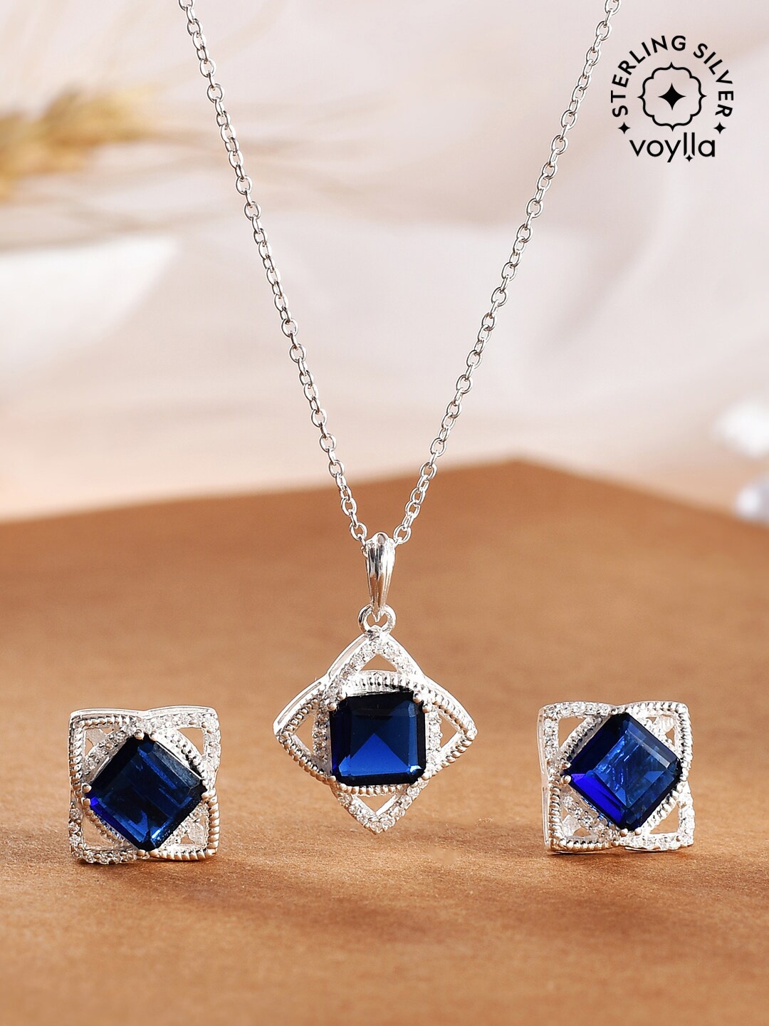 Studio Voylla 925 Silver Blue Square Cut Sapphire and Zircons Rhodium-Plated Pendant Set
Studio Voylla 925 Silver Blue Square Cut Sapphire and Zircons Rhodium-Plated Pendant Set