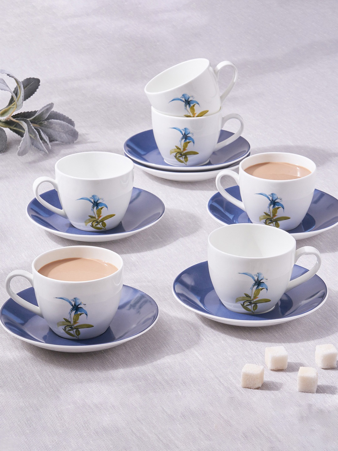 Home Centre 12PC White & Blue Floral Print Bone China Glossy Cups and Saucers- 210 ML Each
Home Centre 12PC White & Blue Floral Print Bone China Glossy Cups and Saucers- 210 ML Each