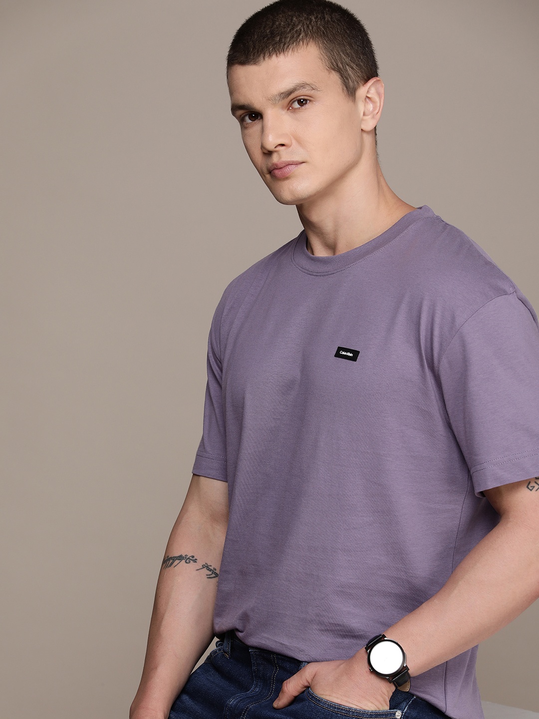 Calvin Klein Jeans Solid With Applique Detail Relaxed Fit Pure Cotton T-shirt, Purple
Calvin Klein Jeans Solid With Applique Detail Relaxed Fit Pure Cotton T-shirt, Purple